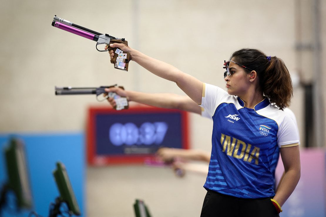 India's Manu Bhaker competes in 10m air pistol mixed team bronze medal match during the Paris 2024 Olympic Games at Chateauroux Shooting Centre on July 30, 2024.