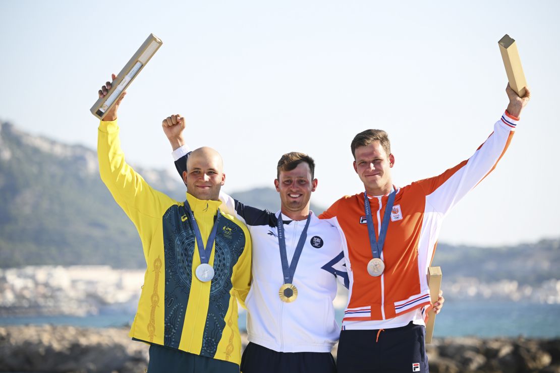 Silver medalist Grae Morris of Team Australia, gold medalist Tom Reuveny of Team Israel and bronze medalist Luuc Opzeeland of Team Netherlands celebrates at the medal ceremony.