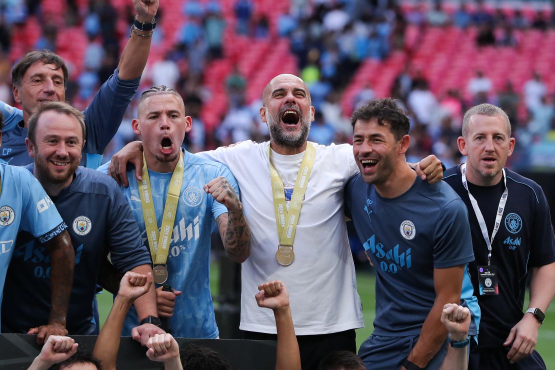 LONDON, ENGLAND - AUGUST 10: Josep 'Pep' Guardiola, manager of Manchester City, celebrates with Kalvin Phillips after the 2024 FA Community Shield match between Manchester United and Manchester City at Wembley Stadium on August 10, 2024 in London, England. (Photo by James Gill - Danehouse/Getty Images)