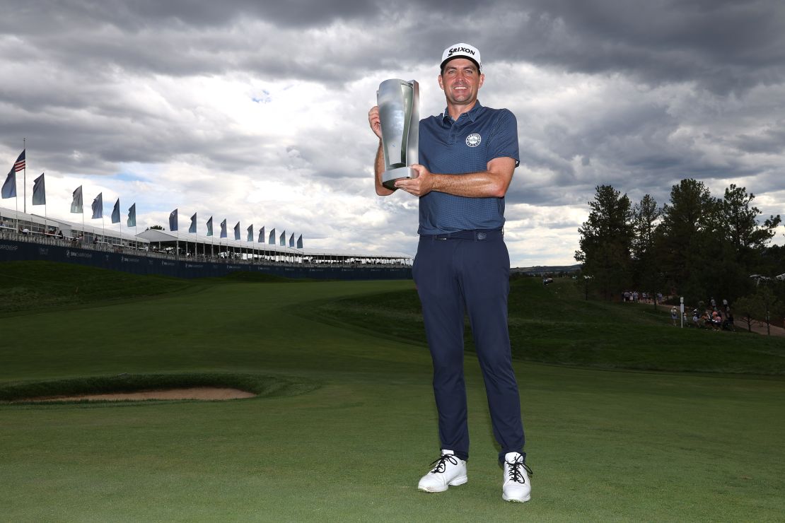 Bradley poses with the BMW Championship trophy after victory in Castle Rock, Colorado.