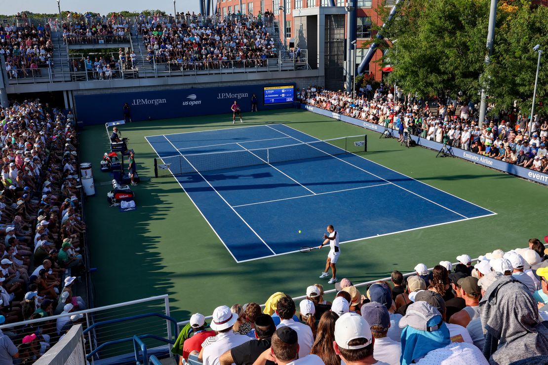 Evans returns a shot against Khachanov.