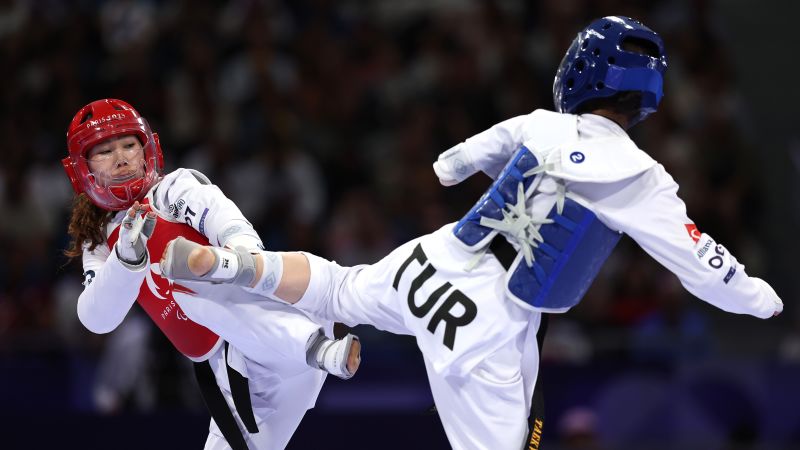 Zakia Khudadadi makes history by winning first-ever Paralympic medal for the refugee team with taekwondo bronze