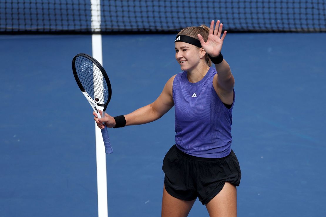 Muchová celebrates after defeating Paolini.