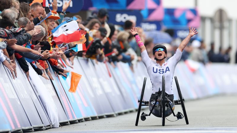 Team USA star Oksana Masters tells CNN she was made to cover up Ukrainian heart sticker on helmet at the Paralympics