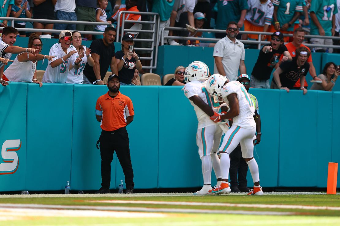 Tyreek Hill #10 of the Miami Dolphins and Jaylen Waddle #17 of the Miami Dolphins celebrate after Hill's receiving touchdown during the third quarter against the Jacksonville Jaguars at Hard Rock Stadium.