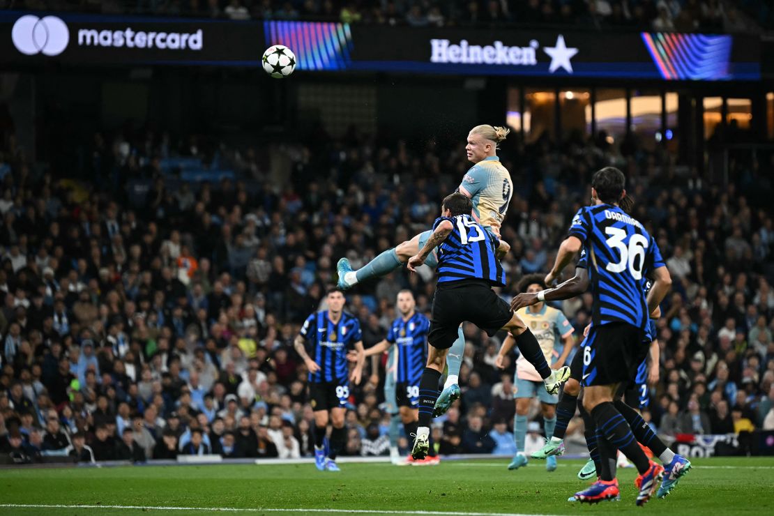 Erling Haaland heads the ball against Inter.