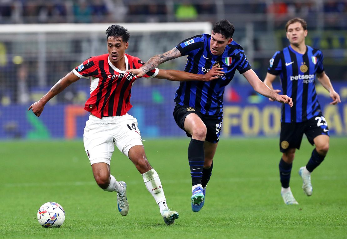 Milan's Tijjani Reijnders (left) and Inter's Alessandro Bastoni vie for the ball during the game.