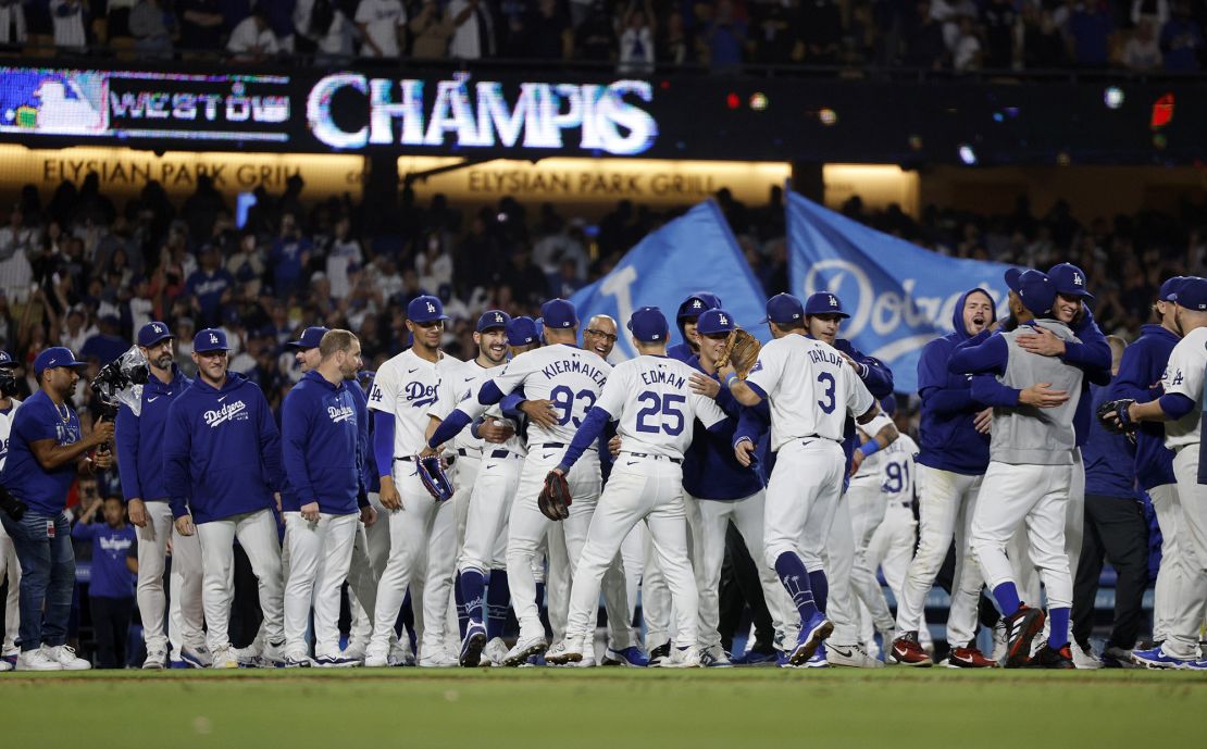 LA celebrates after defeating the San Diego Padres 7-2 to win the NL West at Dodger Stadium.