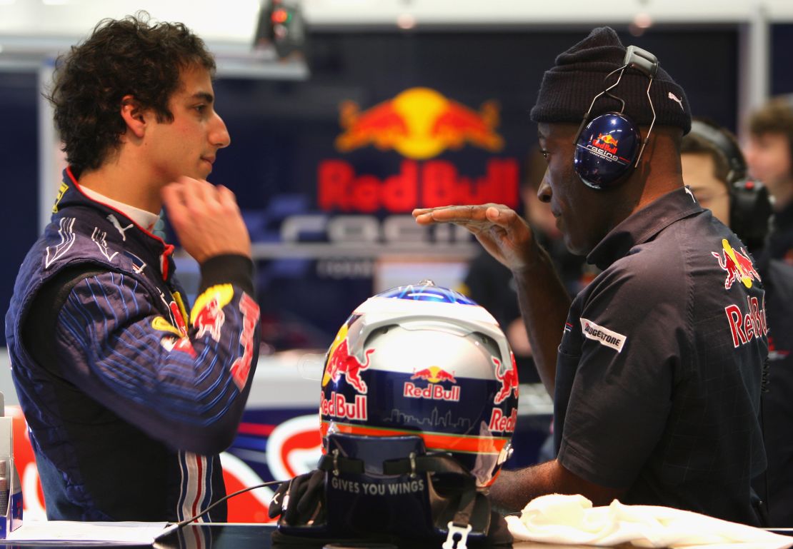 JEREZ DE LA FRONTERA, SPAIN - DECEMBER 02: Daniel Ricciardo of Australia and team Red Bull talks with physio Roger Cleary as he prepares to drive at the Circuito De Jerez on December 2, 2009 in Jerez de la Frontera, Spain. (Photo by Mark Thompson/Getty Images)