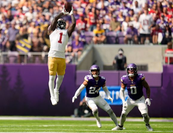 San Francisco 49ers wide receiver Deebo Samuel Sr. catches a pass over Minnesota Vikings safety Camryn Bynum and linebacker Ivan Pace Jr. during a game in Minneapolis on September 15. The Vikings would go on to win the game 24-17.