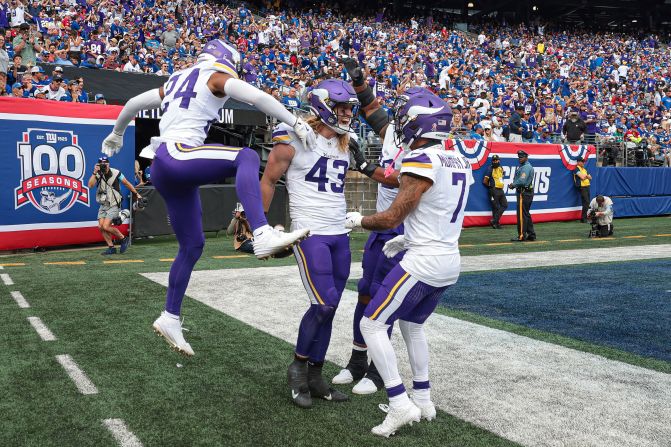 Minnesota Vikings linebacker Andrew Van Ginkel, center, celebrates his interception return for a touchdown during the Vikings' 28-6 victory over the New York Giants in East Rutherford, New Jersey, on September 8.