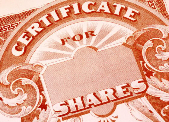 A blank paper stock certificate for shares of a publicly traded company.