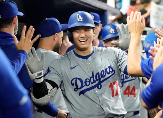 Ohtani celebrates stealing his 50th base of the season.