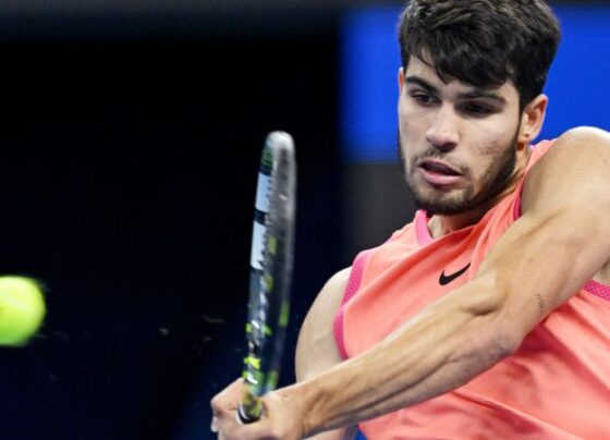 Italy's Jannik Sinner hits a return to Spain's Carlos Alcaraz during the men's singles final at the China Open tennis tournament in Beijing on October 2, 2024. (Photo by GREG BAKER / AFP) (Photo by GREG BAKER/AFP via Getty Images)