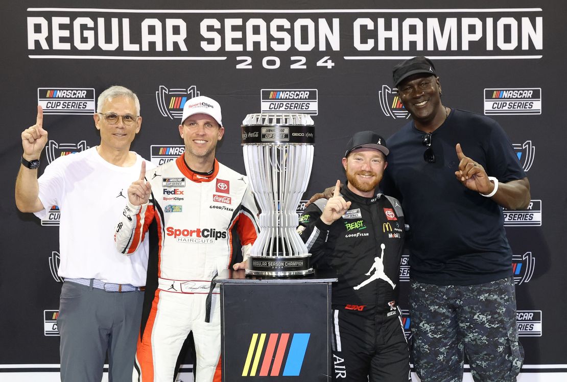 DARLINGTON, SOUTH CAROLINA - SEPTEMBER 01: 2024 Regular Season Champion, Tyler Reddick, driver of the #45 Upper Deck Toyota, poses with Curtis Polk, 23XI Racing co-owners, NBA Hall of Famer, Michael Jordan, and Denny Hamlin, driver of the #11 Sport Clips Haircuts Toyota, after the NASCAR Cup Series Cook Out Southern 500 at Darlington Raceway on September 01, 2024 in Darlington, South Carolina. (Photo by Meg Oliphant/Getty Images)