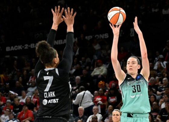 Sabrina Ionescu drives past Las Vegas Aces guard Jackie Young during the New York Liberty's game against the Las Vegas Aces.