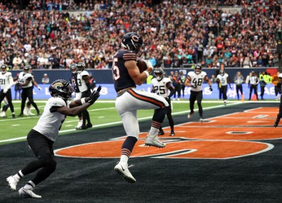 Lawrence hands the ball off during the game.