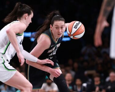 Minnesota Lynx guard Courtney Williams shoots over New York Liberty star Sabrina Ionescu in Game 2 of the WNBA Finals.