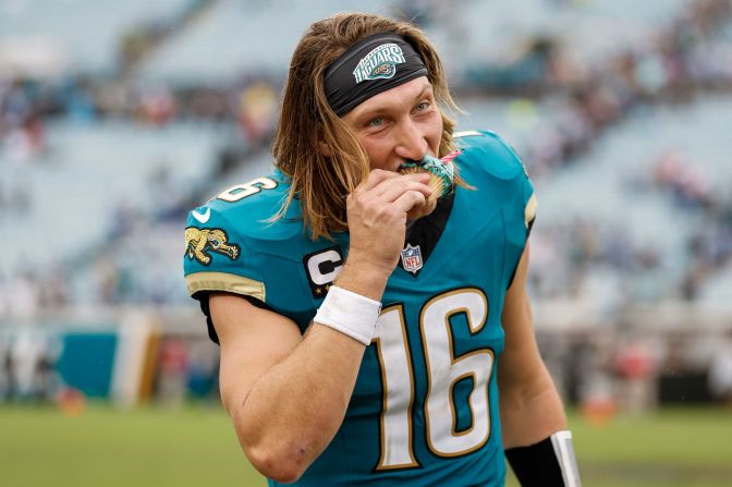 Jacksonville Jaguars quarterback Trevor Lawrence eats a cupcake to celebrate his birthday after his team beat the Indianapolis Colts 37-34 at home in Jacksonville, Florida, on October 6. It was the Jaguars' first win of the season.