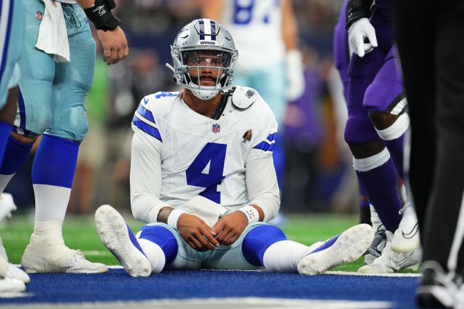 Dallas Cowboys quarterback Dak Prescotts sits on the field after a play during the team's 28-25 loss to the Baltimore Ravens in Arlington, Texas, on September 22.