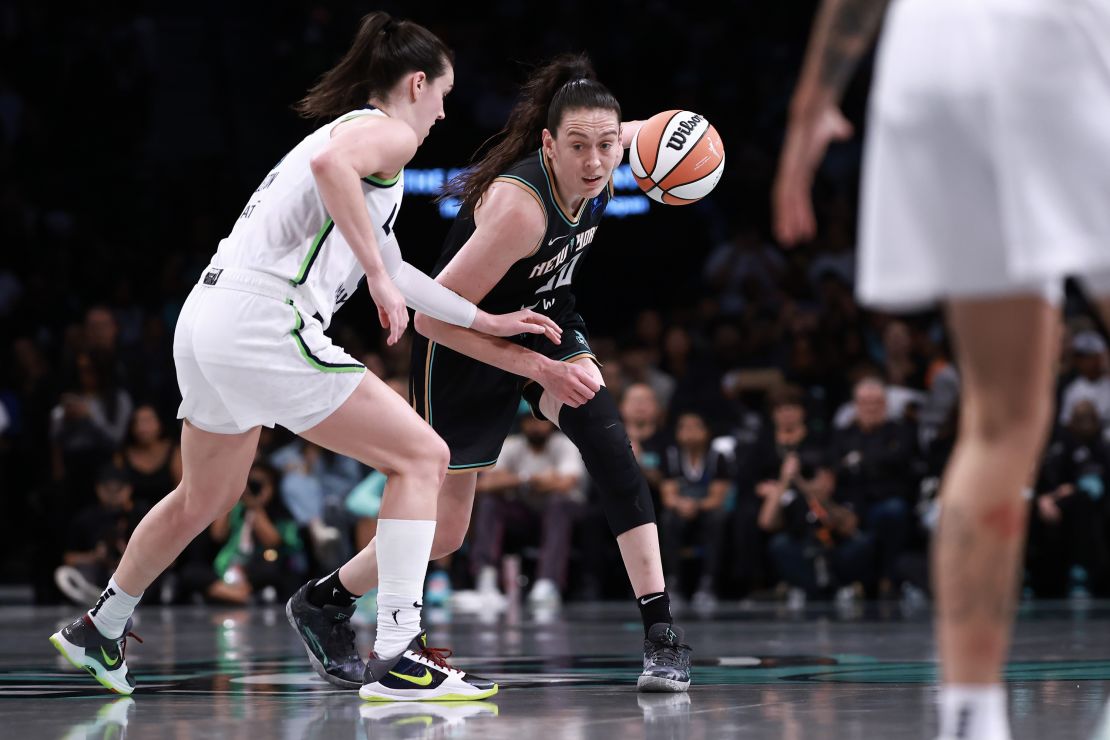 NEW YORK, NEW YORK - OCTOBER 13: Breanna Stewart #30 of the New York Liberty drives past Bridget Carleton #6 of the Minnesota Lynx during the third quarter of Game Two of the WNBA Finals at Barclays Center on October 13, 2024 in New York City. (Photo by Dustin Satloff/Getty Images)