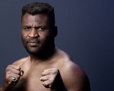 Francis Ngannou faces off with Renan Ferreira during the Battle of the Giants press conference at The Anthem on August 22 in Washington DC.