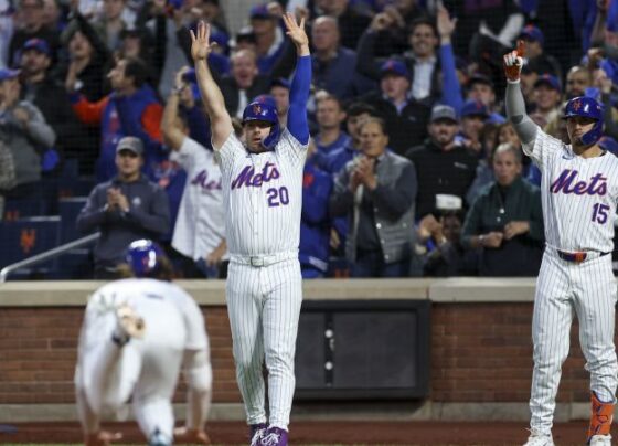 New York Mets fan dressed as Grimace celebrates the team forcing a Game 6 in NLCS.