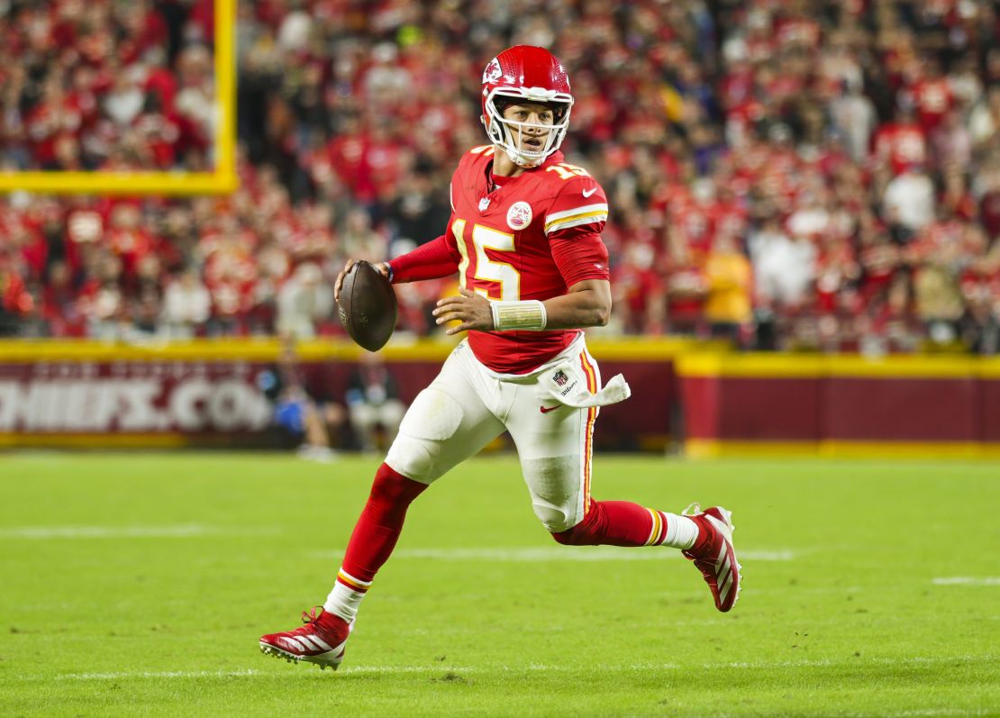 Oct 7, 2024; Kansas City, Missouri, USA; Kansas City Chiefs quarterback Patrick Mahomes (15) rolls out to pass during the first half against the New Orleans Saints at GEHA Field at Arrowhead Stadium. Mandatory Credit: Jay Biggerstaff-Imagn Images