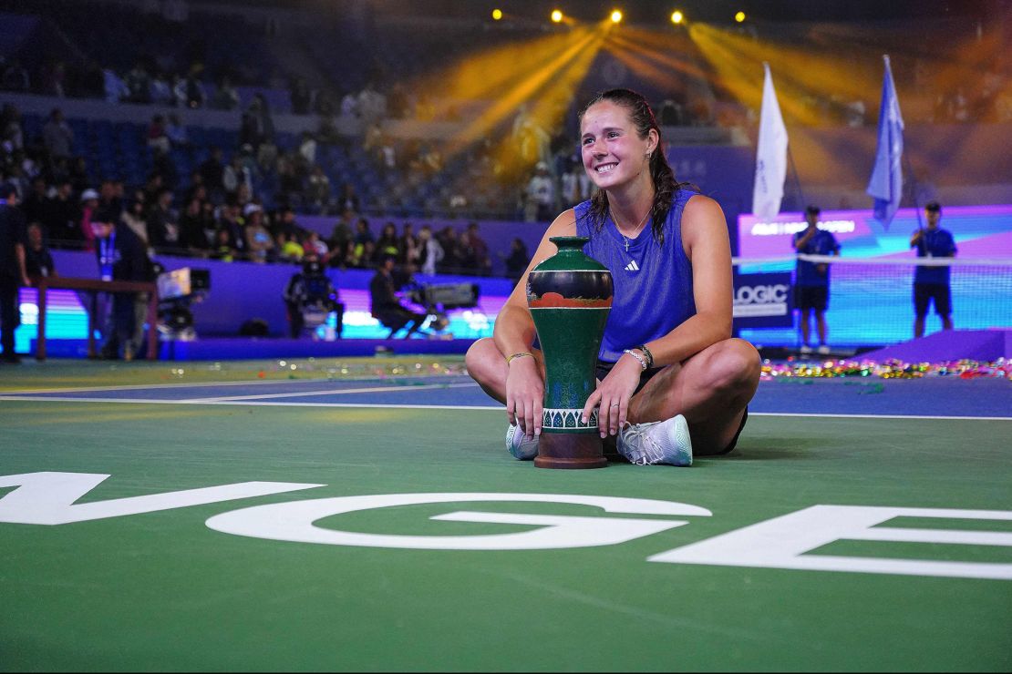 Kasatkina celebrates with her trophy after defeating Andreeva.