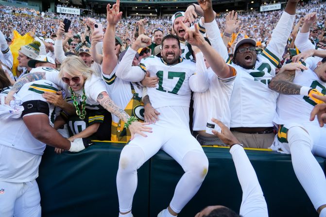 Green Bay Packers kicker Brandon McManus celebrates with fans after kicking the game-winning field goal against the Houston Texans in Green Bay, Wisconsin, on October 20. The Packers won 24-22.