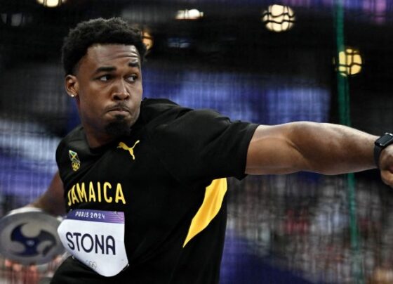 Paris 2024 Olympics - Athletics - Men's Discus Throw Final - Stade de France, Saint-Denis, France - August 07, 2024. Gold medallist Roje Stona of Jamaica celebrates after winning and setting a new Olympic record. REUTERS/Aleksandra Szmigiel