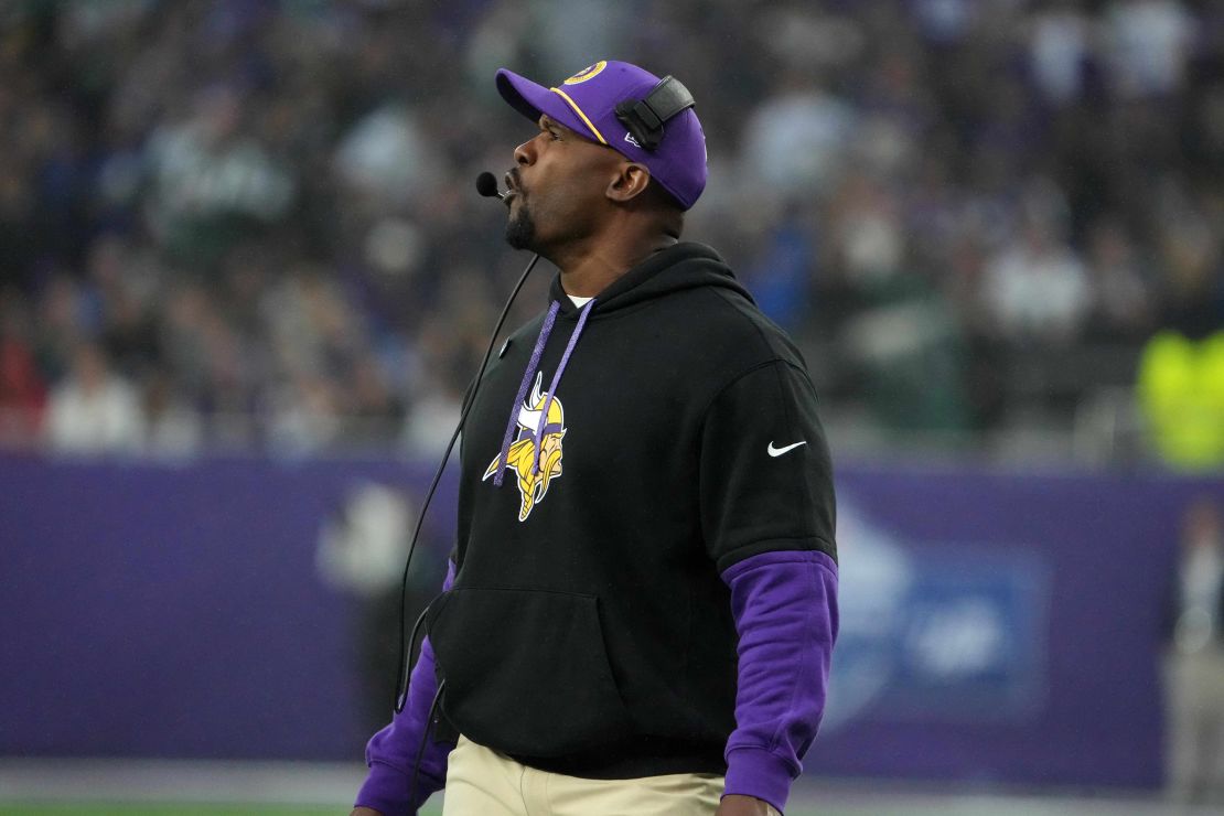 Oct 6, 2024; London, United Kingdom; Minnesota Vikings defensive coordinator Brian Flores watches from the sidelines against the New York Jets in the second half at Tottenham Hotspur Stadium. Mandatory Credit: Kirby Lee-Imagn Images