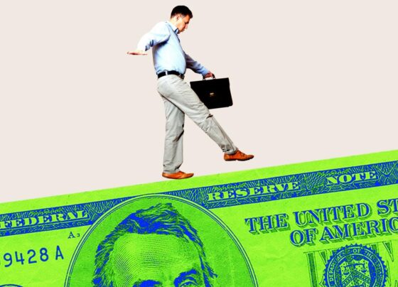 Photo collage of a man with a briefcase walking carefully on a $5 bill as if balancing on a tightrope