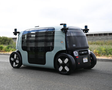 FILE - Phoenix Mayor Kate Gallego arrives in a Waymo self-driving vehicle on Dec. 16, 2022, at the Sky Harbor International Airport Sky Train facility in Phoenix. Self-driving car pioneer Waymo announced Thursday, May 4, 2023, that its robotaxis will be able to carry passengers through most of the Phoenix area for the first time. (AP Photo/Matt York, File)