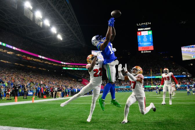 San Francisco 49ers cornerback Isaac Yiadom and safety Ji'Ayir Brown break up a touchdown pass intended for Seattle Seahawks wide receiver DK Metcalf in Seattle on October 10.