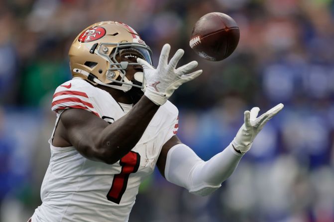 San Francisco 49ers wide receiver Deebo Samuel makes a catch during his team's 36-24 victory over the Seattle Seahawks in Seattle on Thursday, October 10. Samuel became the first wide receiver in NFL history with 20 touchdown receptions and 20 touchdown runs after scoring on a 76-yard touchdown catch.