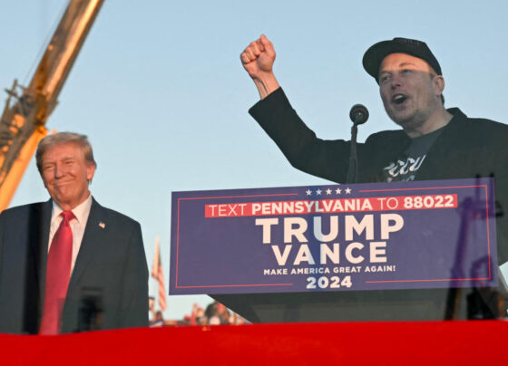 Tesla CEO Elon Musk (R) speaks on stage as he joins former US President and Republican presidential candidate Donald Trump during a campaign rally at site of his first assassination attempt in Butler, Pennsylvania on October 5, 2024. (Photo by Jim WATSON / AFP) (Photo by JIM WATSON/AFP via Getty Images)