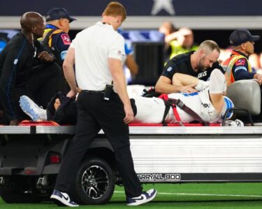 Detroit Lions star pass rusher Aidan Hutchinson carted off field with broken tibia | CNN