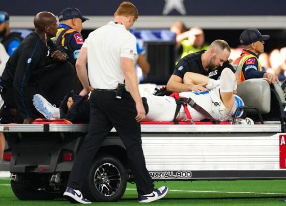 Detroit Lions star pass rusher Aidan Hutchinson carted off field with broken tibia | CNN