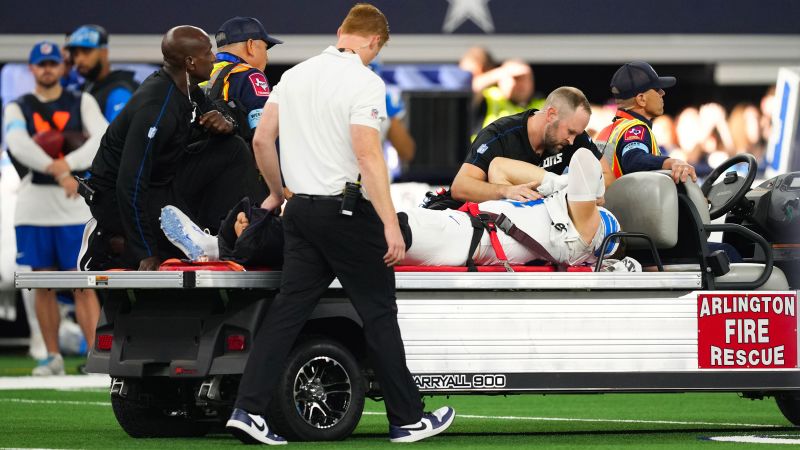 Detroit Lions star pass rusher Aidan Hutchinson carted off field with broken tibia | CNN