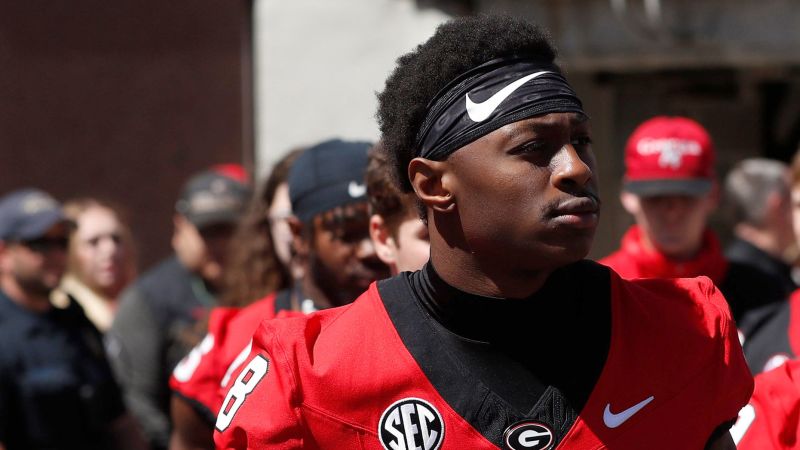 Georgia football player Colbie Young arrested and charged with assault on unborn child and battery | CNN