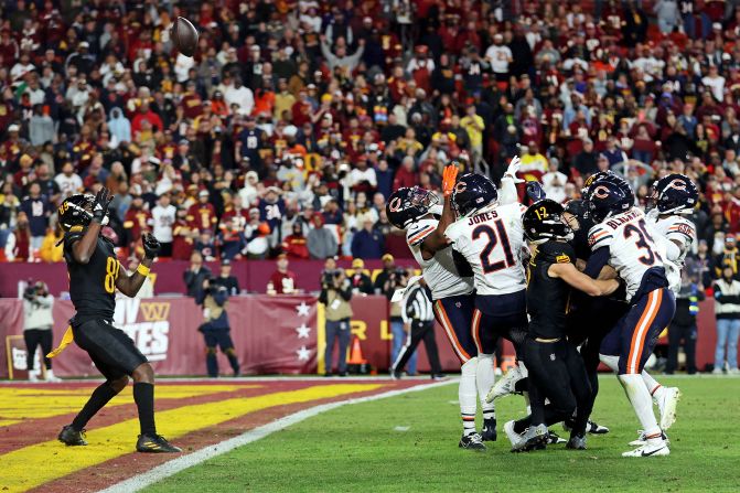 Washington Commanders wide receiver Noah Brown catches a Hail Mary pass that was tipped with no time left to beat the Chicago Bears 18-15 at Commanders Field in Landover, Maryland, on October 27.