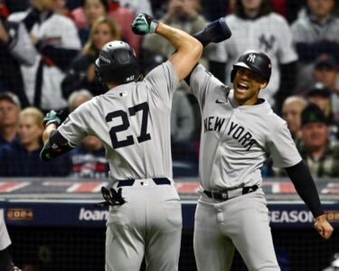 Oct 18, 2024; Cleveland, Ohio, USA; New York Yankees outfielder Juan Soto (22) hits a two run home run against the Cleveland Guardians in the first inning during game four of the ALCS for the 2024 MLB playoffs at Progressive Field. Mandatory Credit: David Dermer-Imagn Images