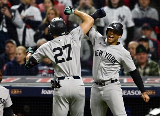 Oct 18, 2024; Cleveland, Ohio, USA; New York Yankees outfielder Juan Soto (22) hits a two run home run against the Cleveland Guardians in the first inning during game four of the ALCS for the 2024 MLB playoffs at Progressive Field. Mandatory Credit: David Dermer-Imagn Images