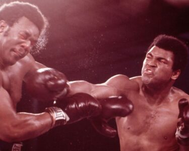 Ali speaks to the press while practicing a jab in Kinshasa, Zaire, October 27, 1974.