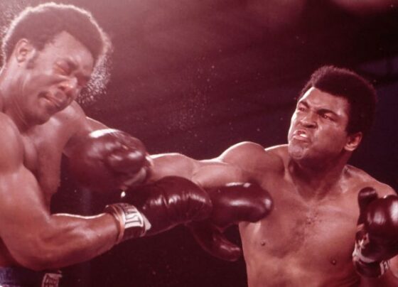 Ali speaks to the press while practicing a jab in Kinshasa, Zaire, October 27, 1974.