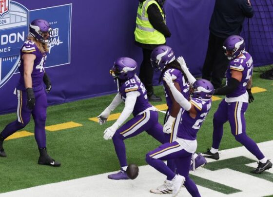 Oct 6, 2024; London, United Kingdom; Minnesota Vikings fans pose with mascot VIktor and cheerleaders before the NFL London Game at Tottenham Hotspur Stadium. Mandatory Credit: Kirby Lee-Imagn Images