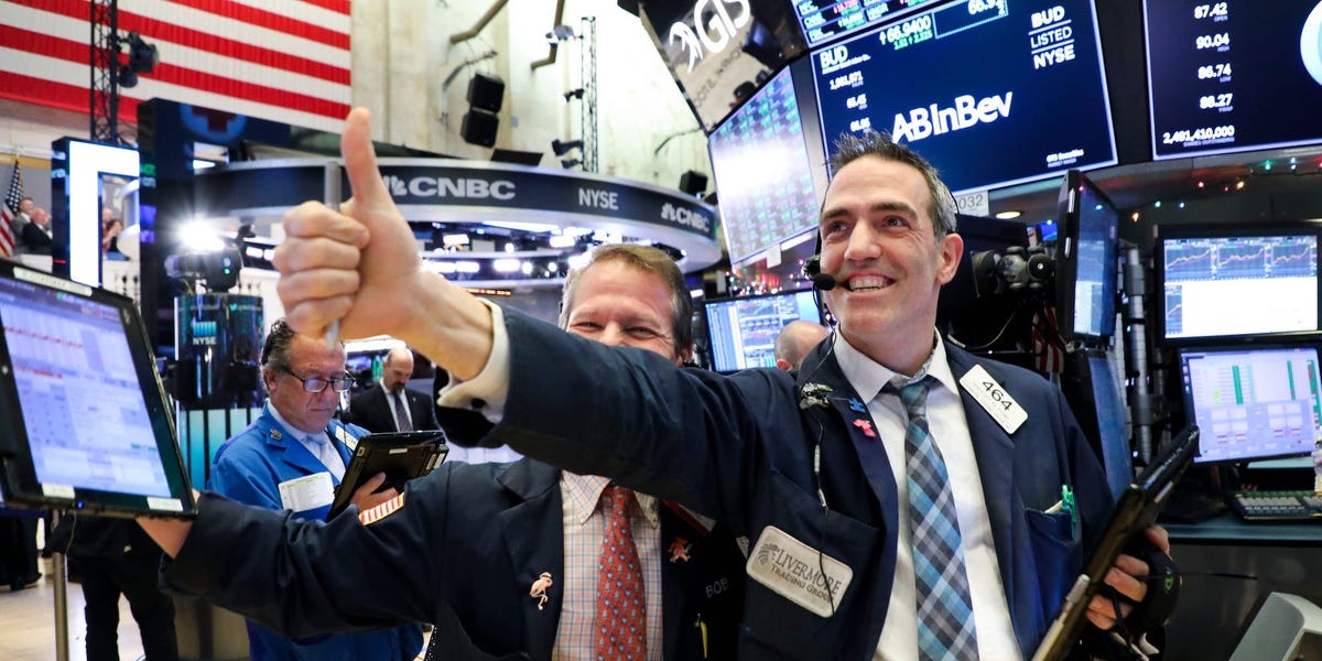 Stock market today: Dow notches record high after strong jobs report eases slowdown worries