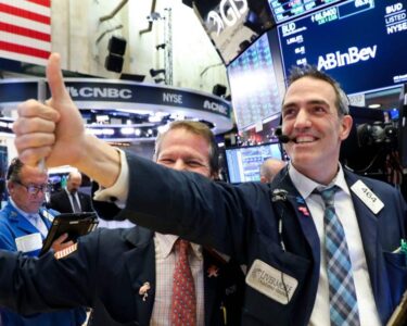 Stock market today: Dow notches record high after strong jobs report eases slowdown worries