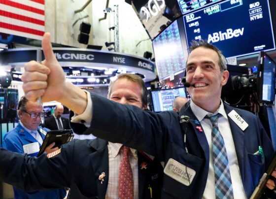 Stock market today: Dow notches record high after strong jobs report eases slowdown worries